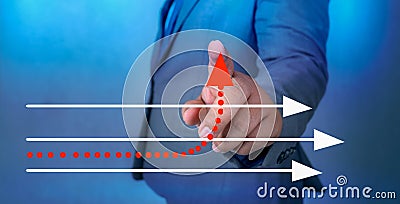 Business different direction The hand of a business man is pointing to a business change point Stock Photo