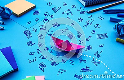 Business direction or goal concepts with boat paper and business doodle icon on worktable background Stock Photo