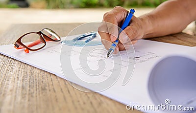 Business,Drawing fiber optic cable on blueprint architectural co Stock Photo