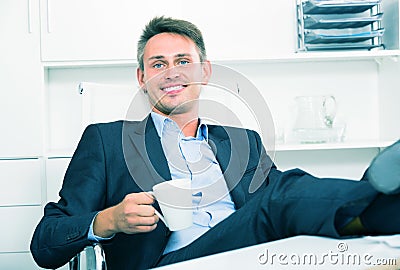 Business employee with coffee at office Stock Photo