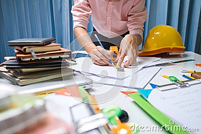 Business engineer contractor working at his desk table in office Stock Photo