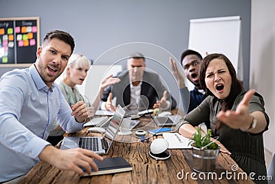 Business Executives Complaining In Office Stock Photo