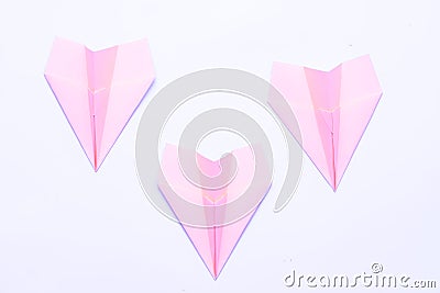 Business failure crisis neon pink paper airplanes Stock Photo