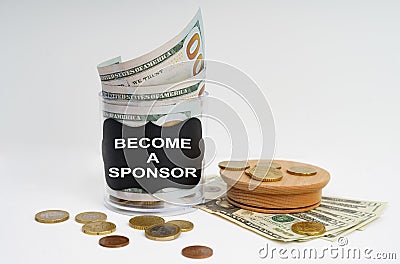 There is a bank with money on the table, it says - BECOME A SPONSOR Stock Photo