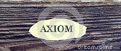 Business and finance concept. Top view of piece of paper written word AXIOM on wooden background Stock Photo