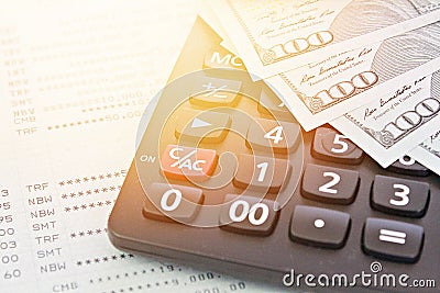 American Dollars cash money, calculator on savings account passbook or financial statement Stock Photo