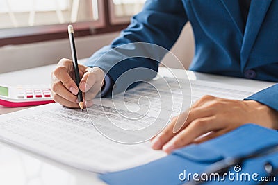 Businessman check about cost and doing finance report data Stock Photo