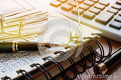 Business finances concept. Book with figures and money in an office. Stock Photo