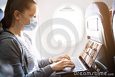 Business Flight Passenger Using Internet Video Conference Stock Photo