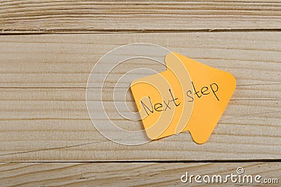 Business, future and motivation concept - orange sticker in the shape of an arrow and text Stock Photo