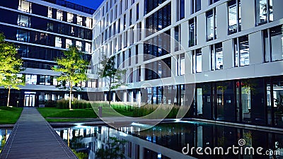 Business Garden complex in night. Seven independent buildings characterized by original architecture and an internal green garden. Editorial Stock Photo