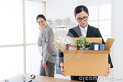 Business girl holding personal belongings box Stock Photo