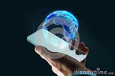 Hand with smartphone and earth hologram Stock Photo
