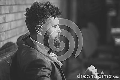 Business on the go. Confident bar customer sit in cafe. Businessman with long beard in cigar club. Date meeting of Stock Photo