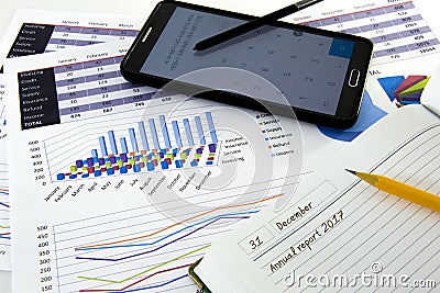 Business graphs and charts report with pen on desk of financial advisor. Financial accountancy Concept. Stock Photo