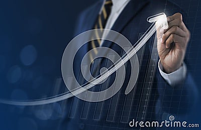 Business growth, boost up business, progress in business or success concept. Businessman is drawing exponential growth graph on Stock Photo