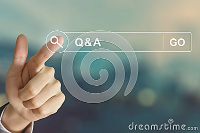 Business hand clicking Q&A or Question and Answer button on sear Stock Photo