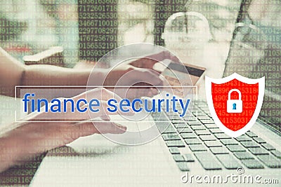 Business hand typing on a laptop keyboard with finance security Stock Photo
