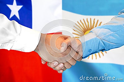 Handshake on Chile and Argentina flag background Stock Photo