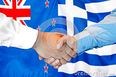 Handshake on New Zealand and Greece flag background Stock Photo