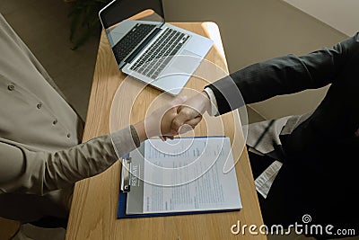 Business handshake. Business people shaking hands, finishing up a meeting,Success agreement negotiation Editorial Stock Photo