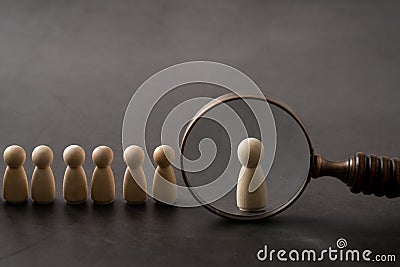 Business & HR global wood puzzle concept for leadership and team with peg doll and hand Stock Photo