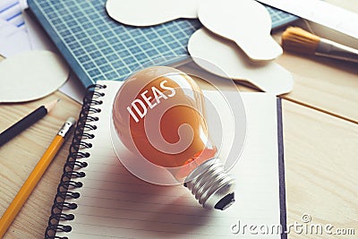 Business ideas with lightbulb on desk table.Creativity,education,inspiration concept Stock Photo