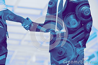 Business industry, engineer businessman handshake overlay with machine gear Stock Photo