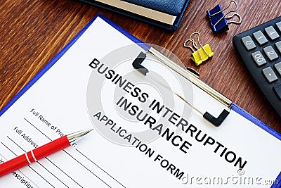 Business interruption insurance form and pen for signing. Stock Photo