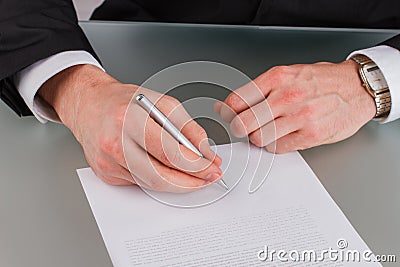 Business investor signing a contract close up. Stock Photo