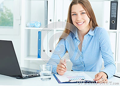 Portrait of smiling secretary in office. Business job offer, financial success, certified public accountant concept. Stock Photo