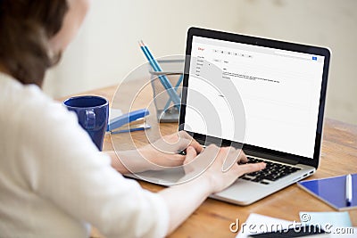 Business lady in office typing reply to corporate email. Stock Photo