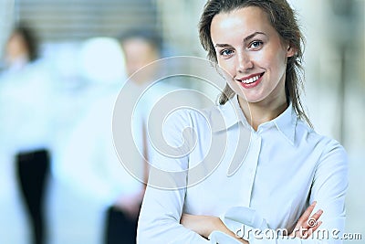 Business lady with positive look and cheerful smile posing Stock Photo