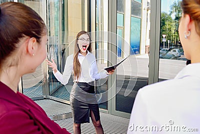 Business lady screams at subordinates. Conversation on high tones. Stock Photo