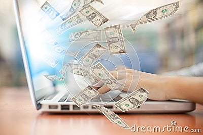 Business a laptop online business making money dollar bills Stock Photo