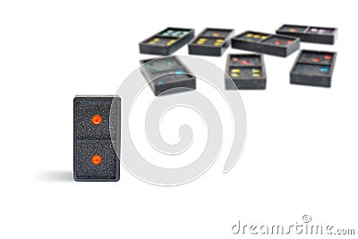 Close up old black dominoes pieces with colorful dot isolated on white background. Stock Photo