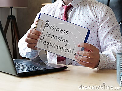 Business licensing requirements is shown on the conceptual business photo Stock Photo