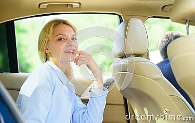 Business life concept. Business woman sit on backseat. Busy lady passenger leather car salon enjoy journey with Stock Photo