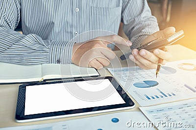 Business man or accountant working Financial investment on calculator with calculate Analyze business and market growth on Stock Photo