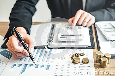 Business man Accounting Calculating Cost Economic budget investment and saving concept Stock Photo