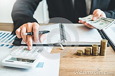 Business man Accounting Calculating Cost Economic budget investment and saving concept Stock Photo