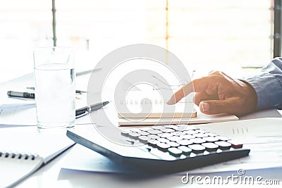 Business man Accounting Calculating Cost Economic concept Stock Photo