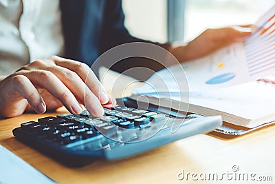 Business man Accounting Calculating Cost Economic Financial data Stock Photo