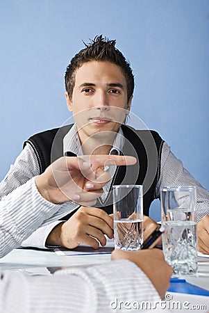 Business man behind a pointing hand Stock Photo