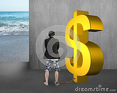 Business man being shackled with gold dollar Stock Photo