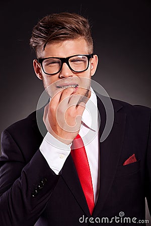 Business man bitting nails Stock Photo