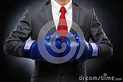 Business man in blue boxing gloves Stock Photo