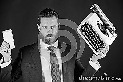 Business man in blue suit and tie with typewriter, card Stock Photo