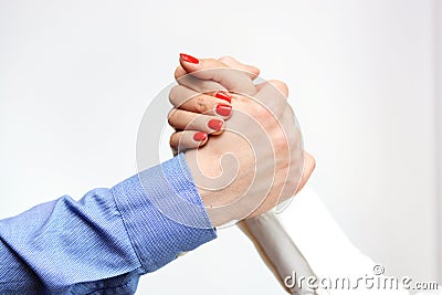 Business man and business woman shaking hands suggesting gender equality at the office Stock Photo