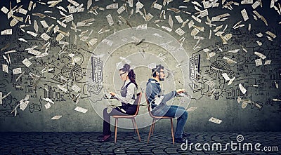 Business man and businesswoman working on computer developing successful strategy under money rain Stock Photo